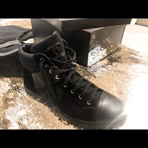 Chanel unisex high-top sneakers.